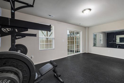 A home gym with a bench and weights