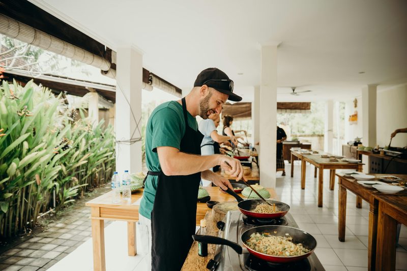 Cooking on burners at an outdoor kitchen bench