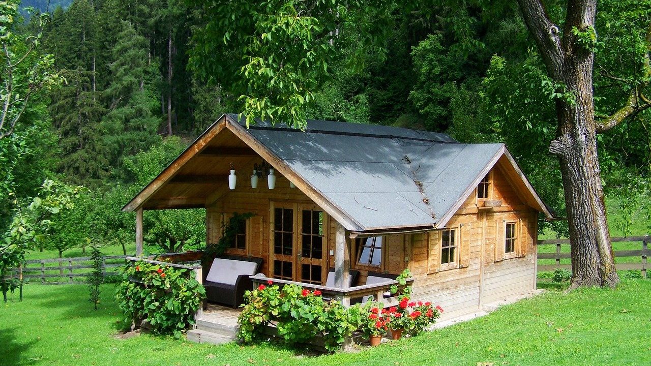 A timber garden cabin on a lawn